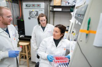 Agneta Simionescu, right, works with bioreactors in her lab with students Laura McCallum and Spencer Marsh.