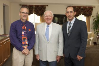 A conference in Greenville on Feb. 22 is named for Jerry Dempsey, center, and his late wife, Harriet. He is pictured with conference organizers, Kevin Taaffe, left, and Dan Simionescu.
