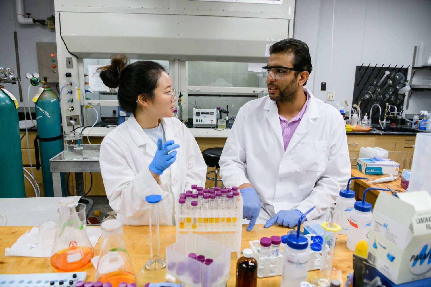 Mohamed Ateia, right, and Weija Yu, a visiting Ph.D. student from the University of Copenhagen, work at L.G. Rich Environmental Laboratory.