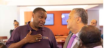 Reggie Hawthorne talks to Clemson Chief of Staff Max Allen.