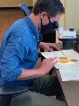 Koski at microscope