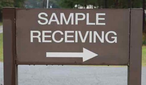 Sign at Ag Services building pointing to dock where soil samples can be left.