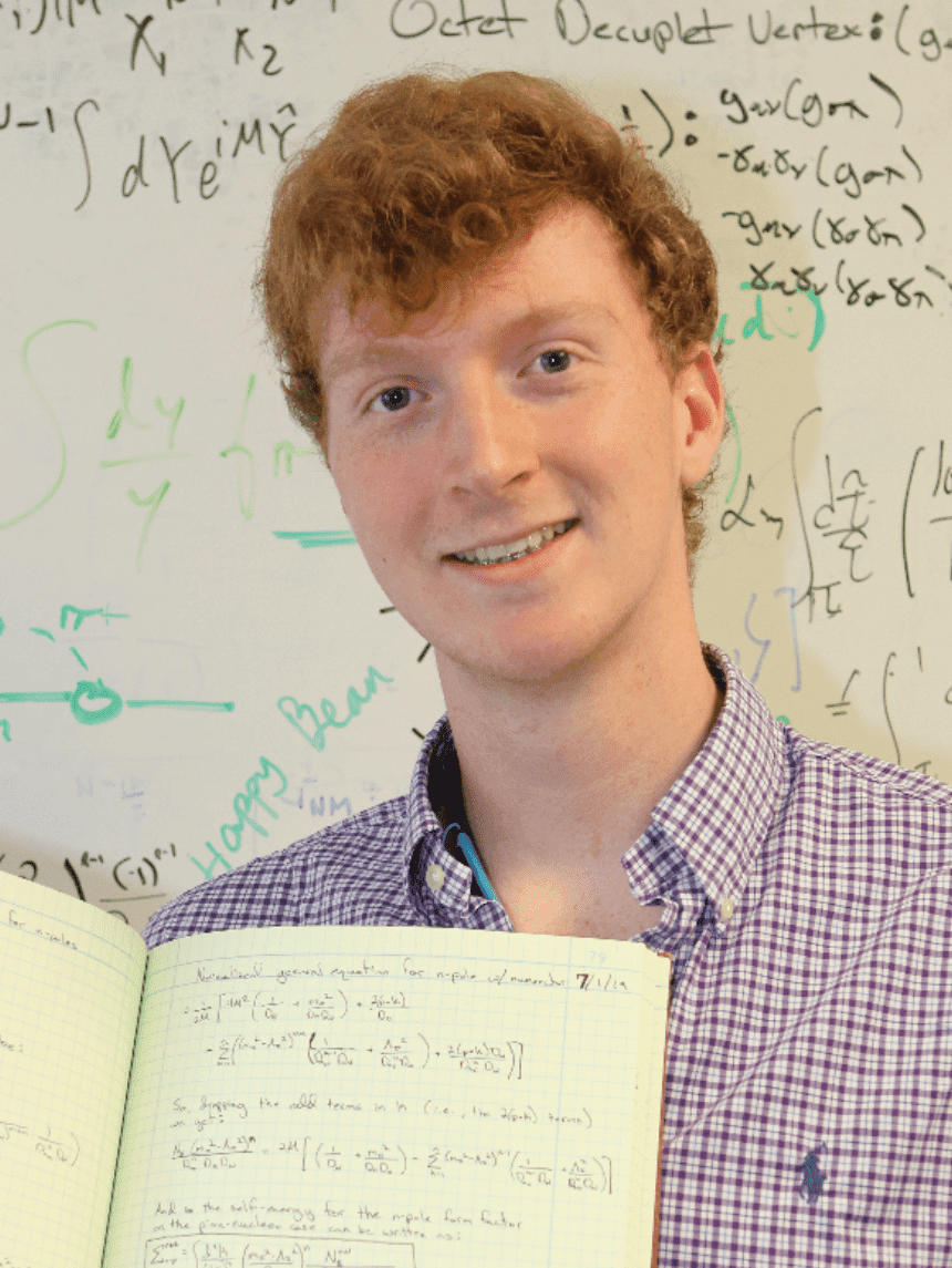 Marston Copeland, a NSF Fellow holding a book in his hand