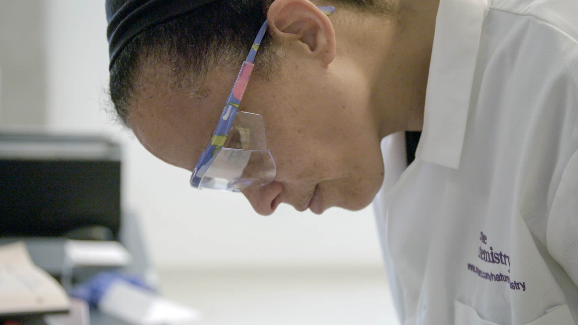 closeup of a woman scientist with googles
