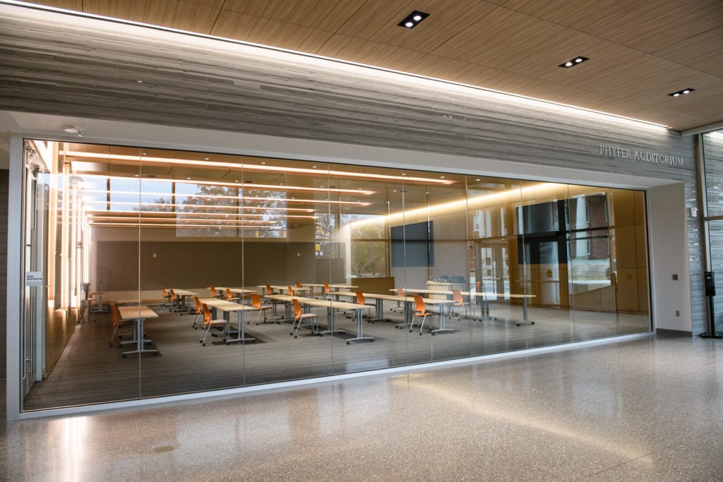 Interior shot of Phyfer Auditorim showing tables, chairs and lighting