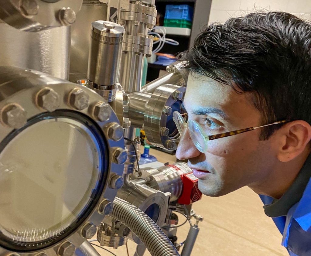 man looking at machine