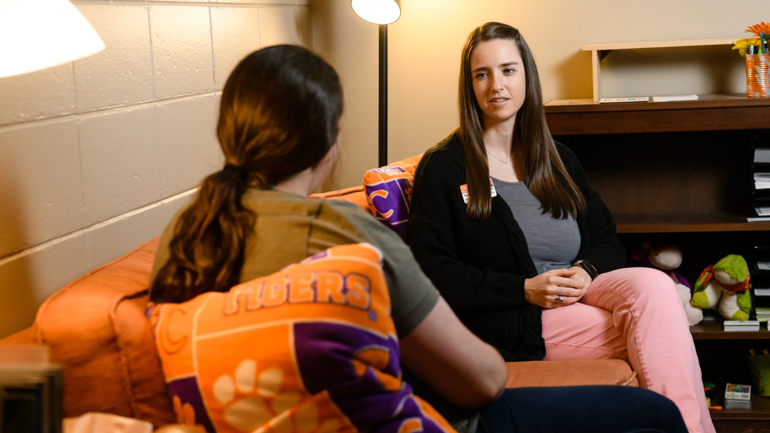 Sarah Allen, coordinator of CU CARES, speaks with a student in her office at Redfern Health Center