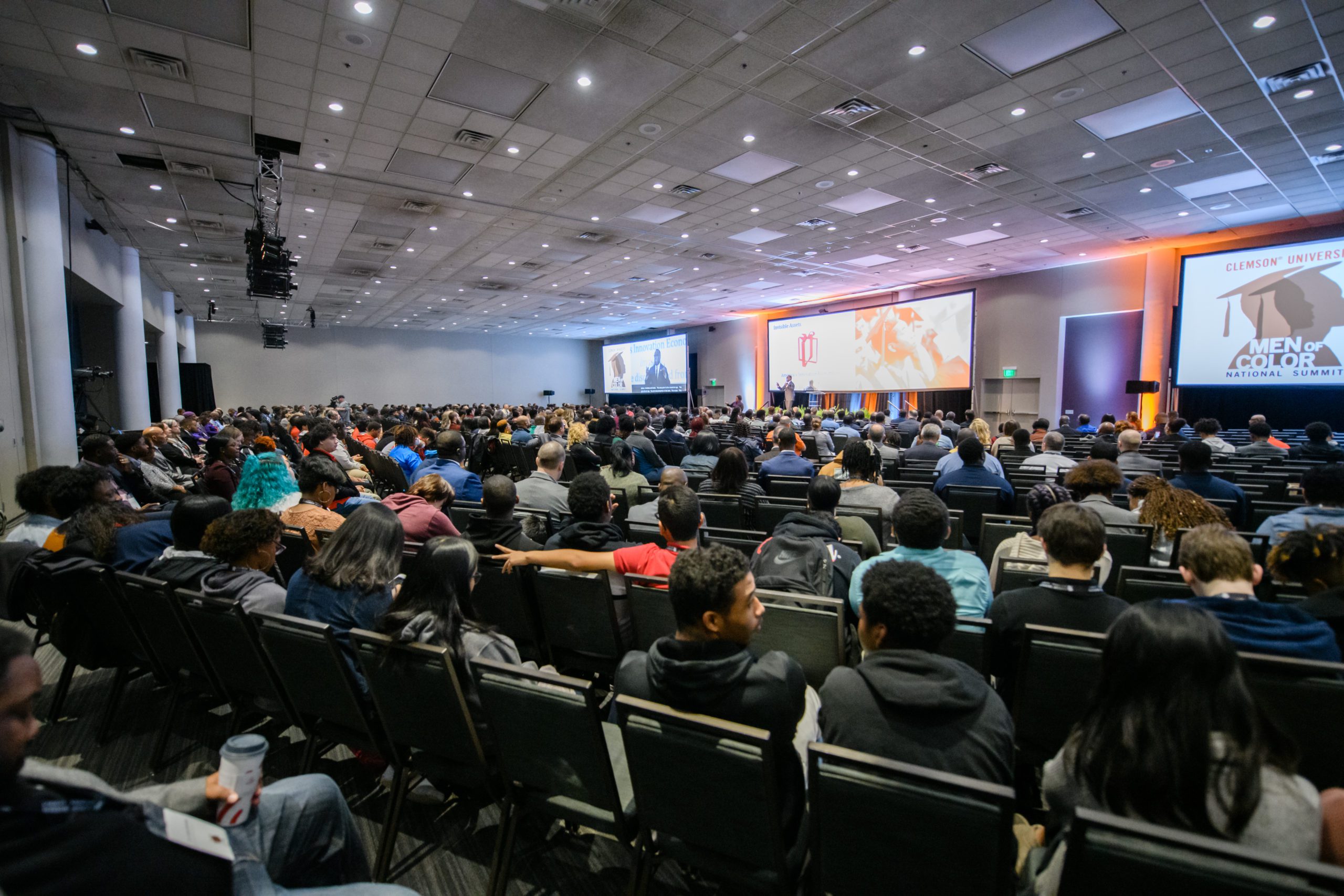 Students sitting in large room viewing presentation at the 2020 Clemson University Men of Color Summit.