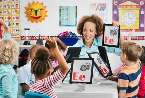 A teacher teaching her students