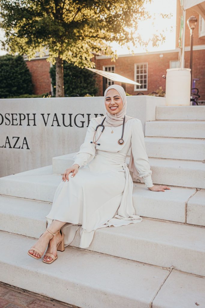 Phi Kappa Phi fellowship recipient and Clemson University alumna Roann Abdeladl posing on the steps of the Loyola University Chicago Stritch School of Medicine.