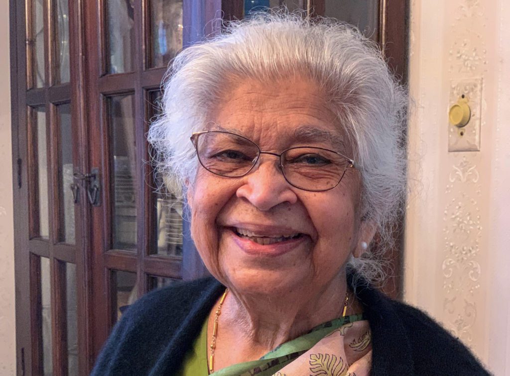 Headshot of a woman, Renu Laskar, with gray hair