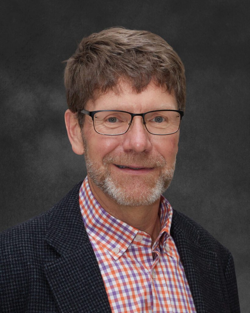 Studio headshot of James Morris