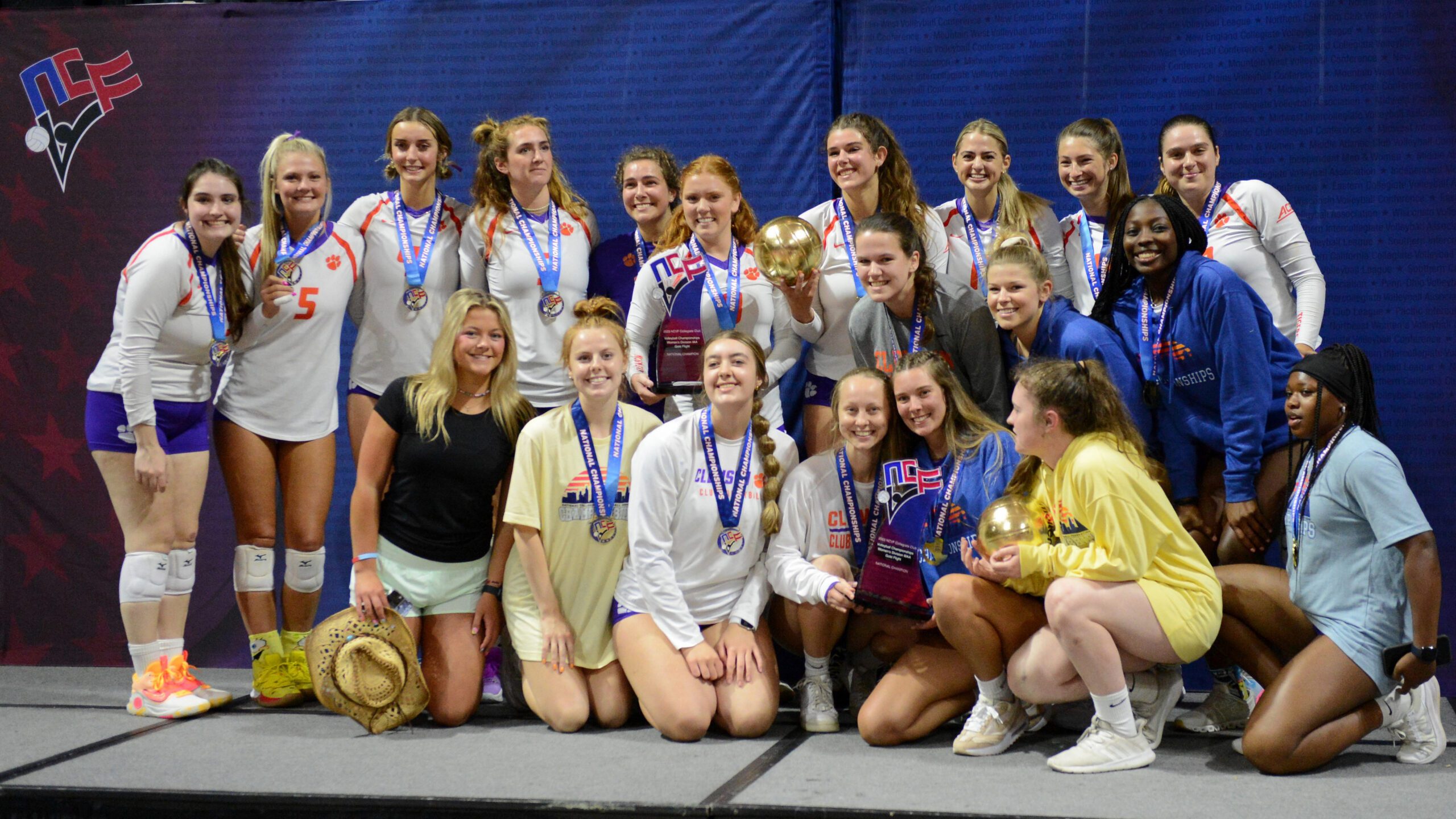 Club volleyball team members celebrate a pair of national championships won on Saturday, April 15, 2023
