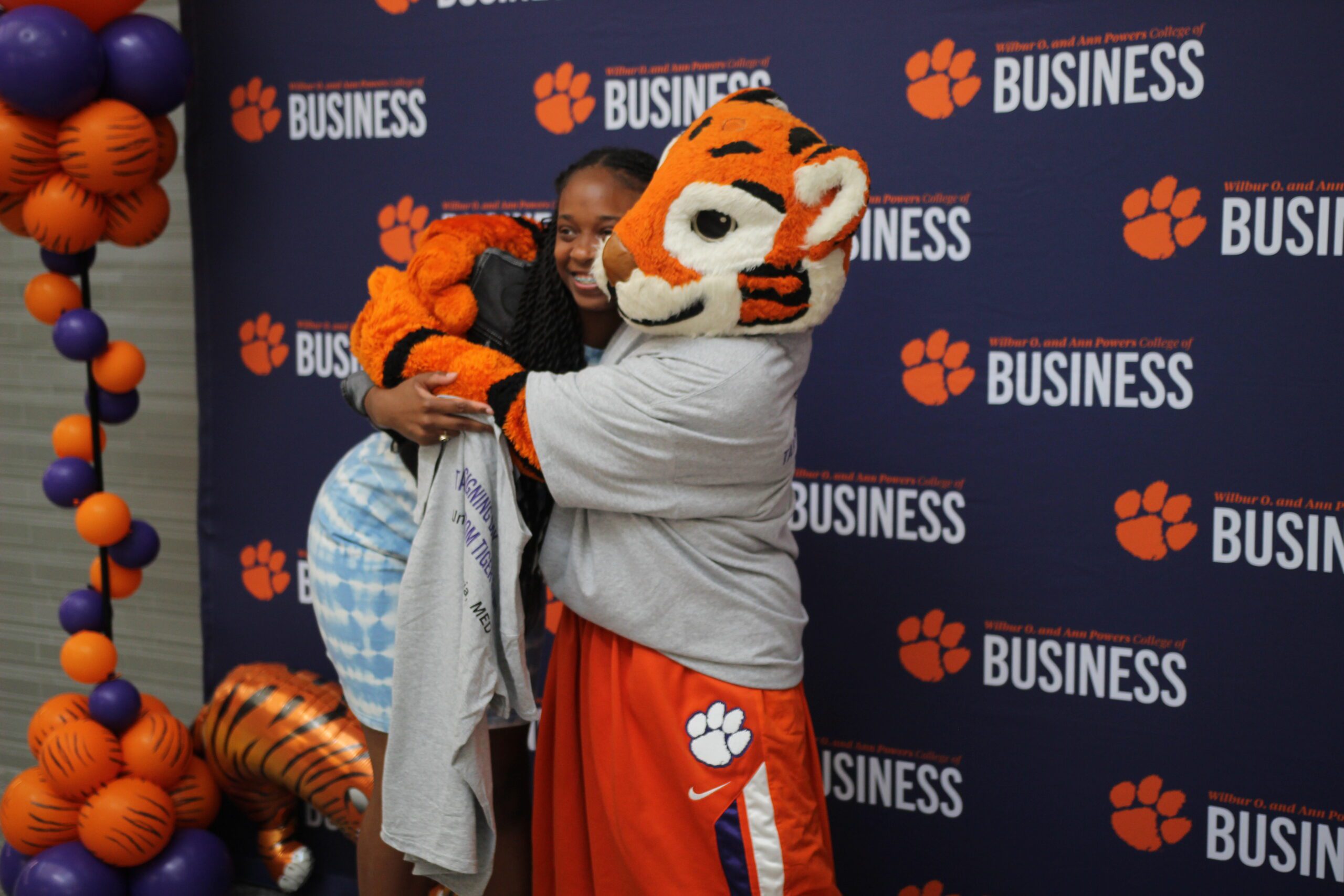 A student hugging the tiger at signing day.