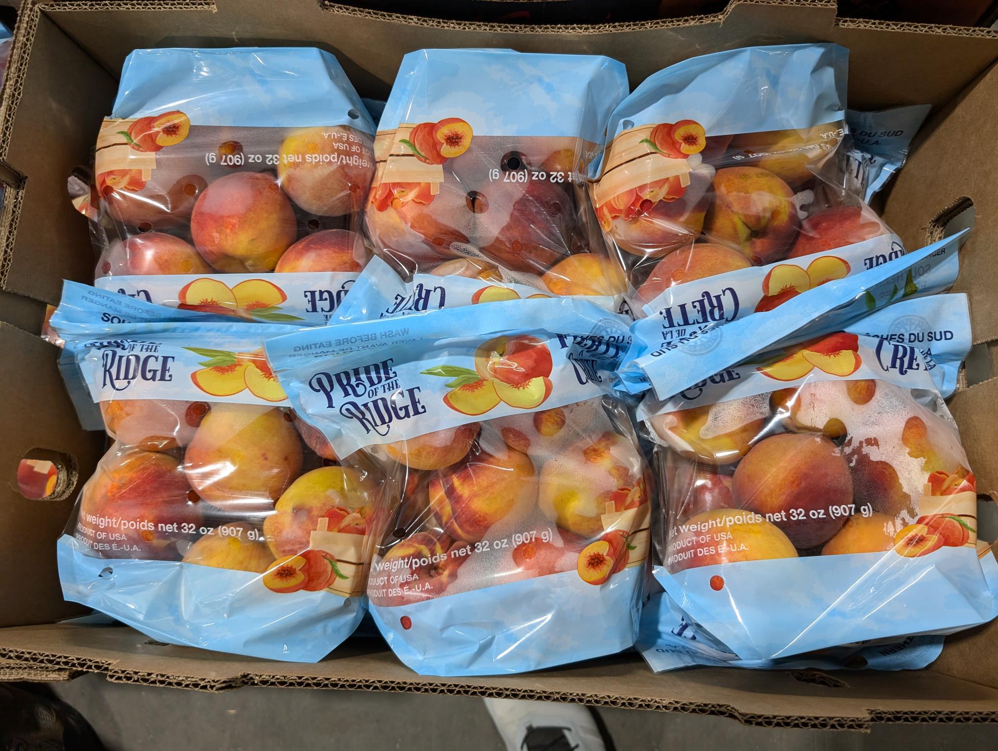 Bags of Titan Farms peaches in a box.
