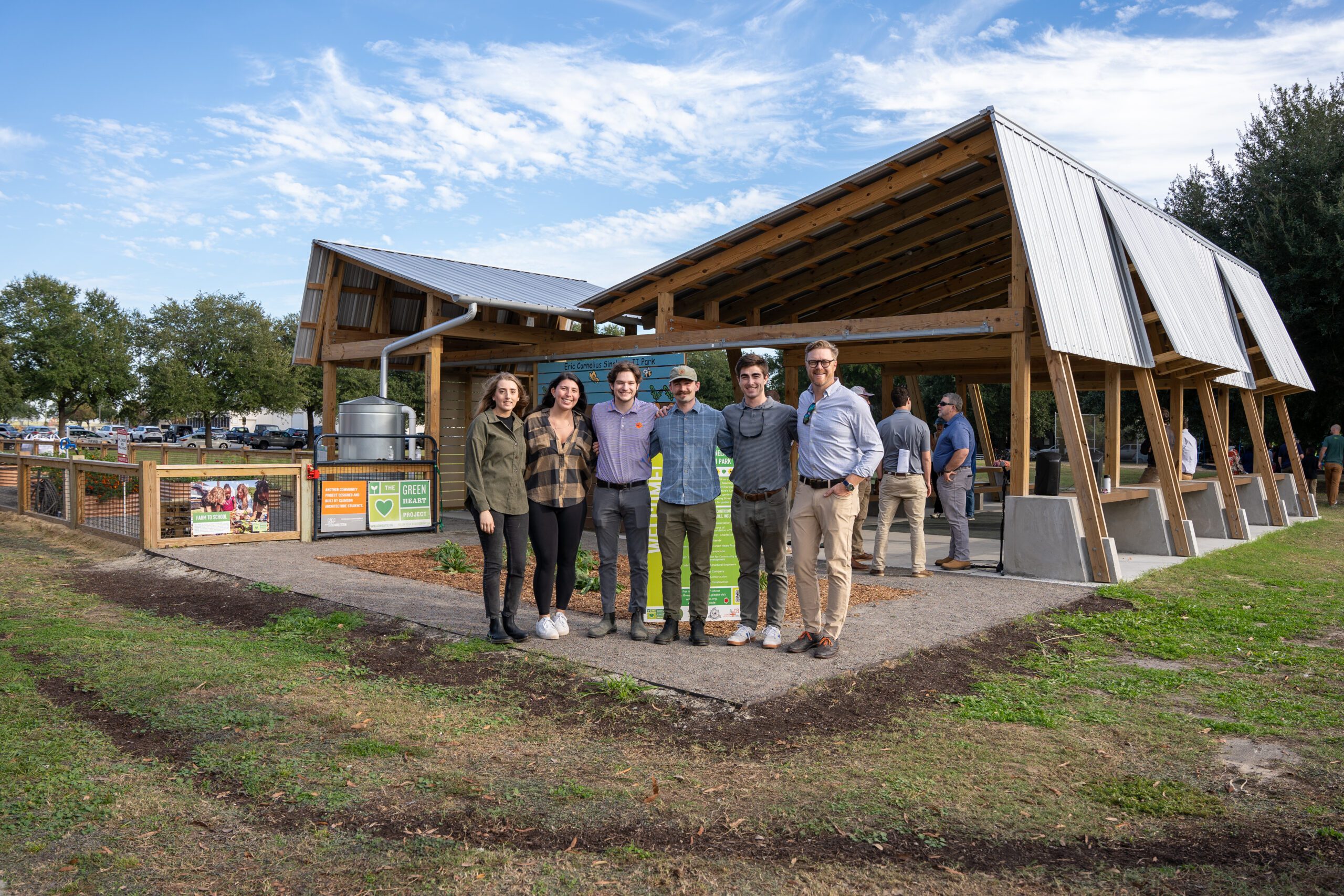 School of Architecture alumni standing in front of a recent A+cB project that was opened to the public.