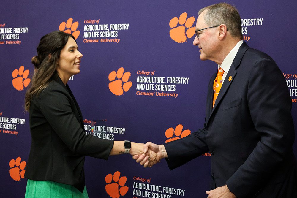 Dean Holt congratulates Erika Hwang