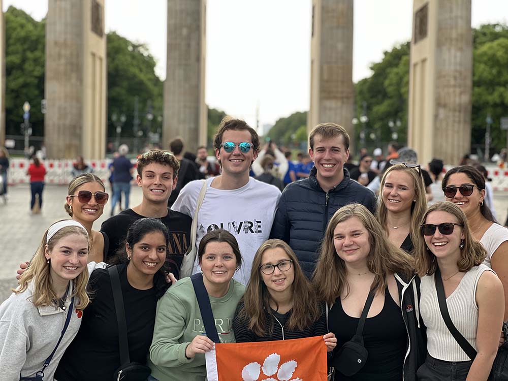 Briggs Murray posing with his Dixon Global Policy Scholars cohort, one of whom is holding a Tiger Rag, in Europe last May.