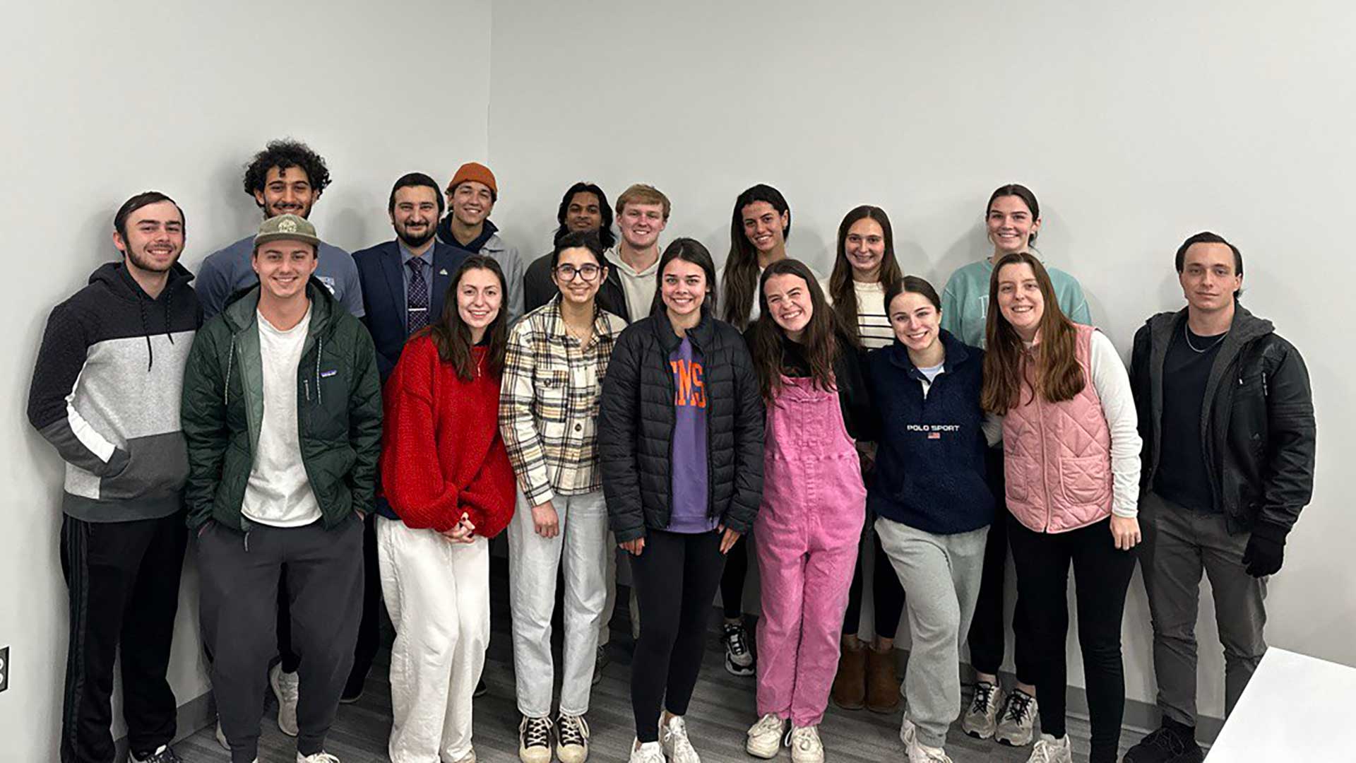 Students in last fall's HON 3960 seminar about Grand Challenges in Engineering posing together by a wall.