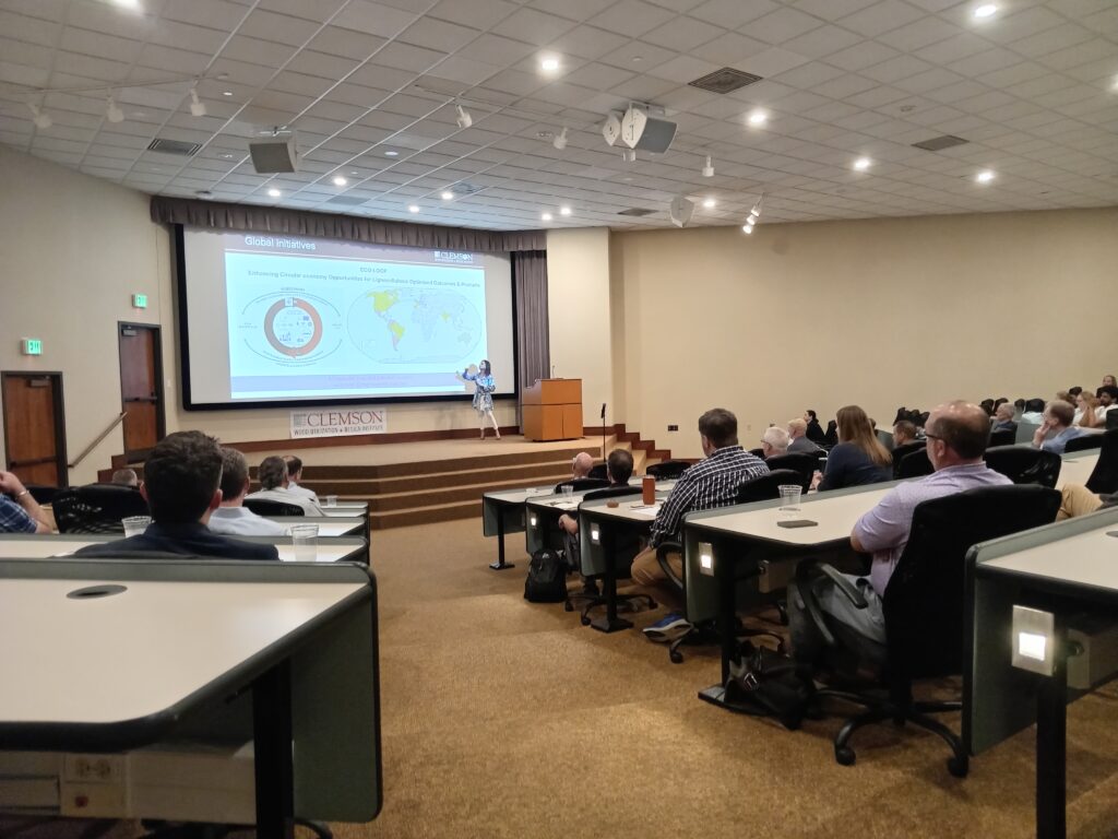 Forestry industry stakeholders watch a presentation by WU+D directort Soledad Peresin.
