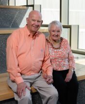 David and Sandra Sprouse seated inside the Wilbur O. and Ann Powers College of Business.