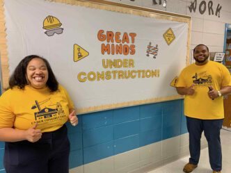 A.J. Richard '20 alongside another teacher inside a classroom at Powdersville Elementary
