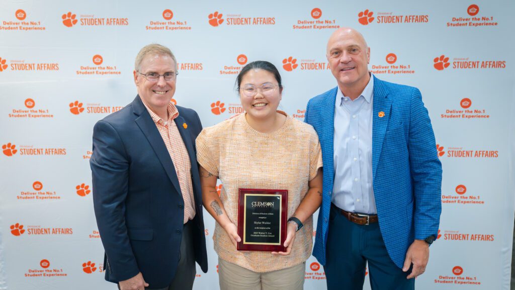 Vice President Doug Hallenbeck and President Jim Clements pictured with Skylar Walder at a 2025 Student Affairs awards program