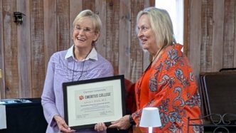 Laura Shick accepts an award.